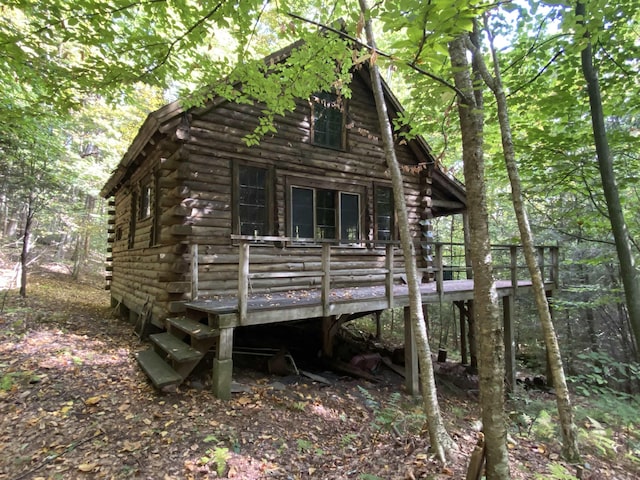 view of side of property featuring a deck