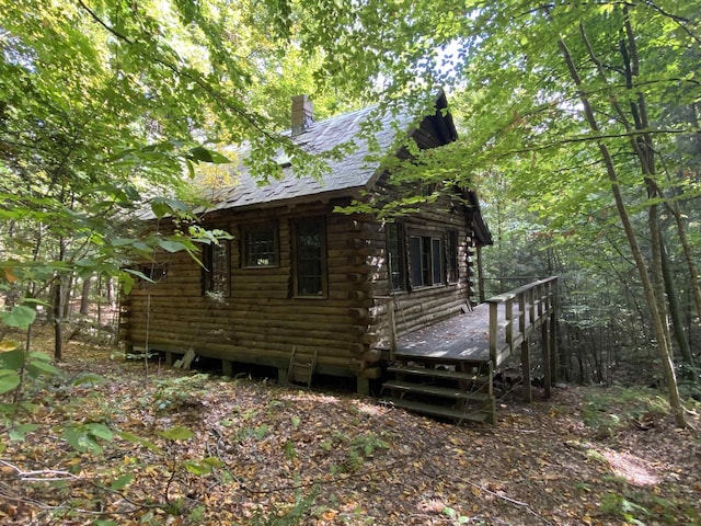 view of side of property with a deck