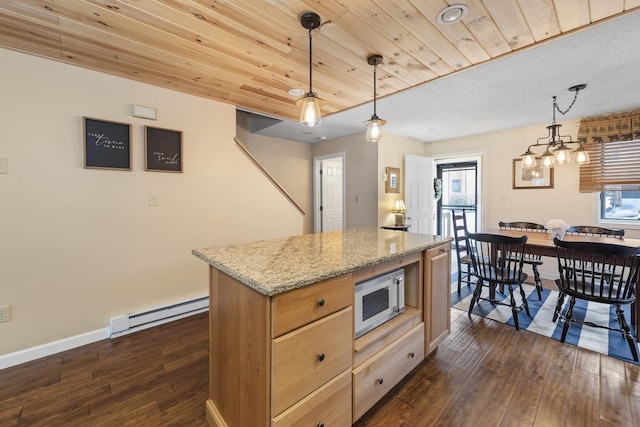 kitchen with baseboard heating, light stone countertops, dark wood-type flooring, and decorative light fixtures