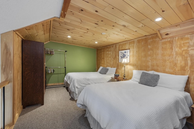 bedroom with wooden walls, carpet, and wooden ceiling