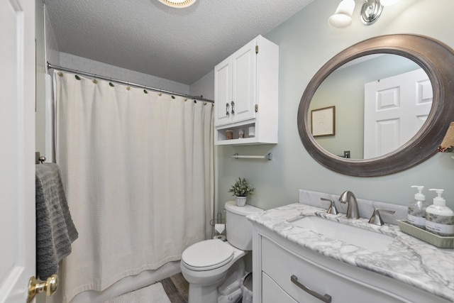 bathroom featuring vanity, a shower with curtain, hardwood / wood-style flooring, toilet, and a textured ceiling