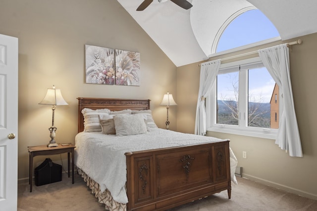 bedroom featuring ceiling fan, light carpet, and vaulted ceiling