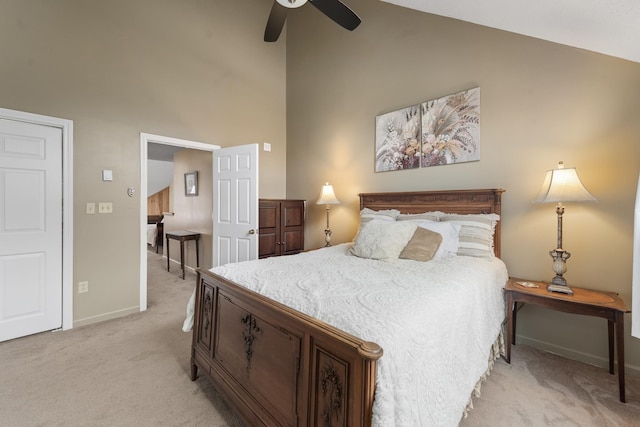 bedroom featuring light colored carpet, high vaulted ceiling, and ceiling fan