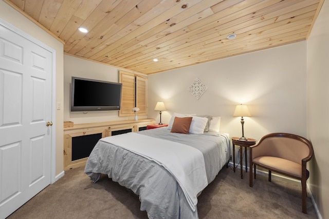 carpeted bedroom with wood ceiling