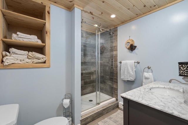 bathroom with an enclosed shower, vanity, toilet, and wooden ceiling