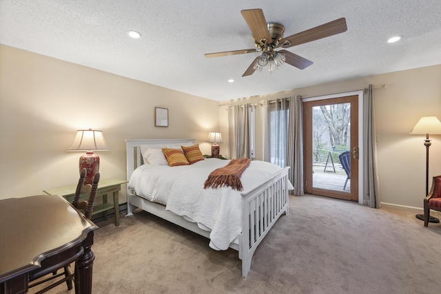 bedroom with a textured ceiling, ceiling fan, light carpet, and access to outside