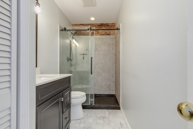 bathroom with vanity, walk in shower, and toilet