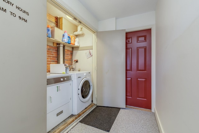 clothes washing area featuring washing machine and dryer