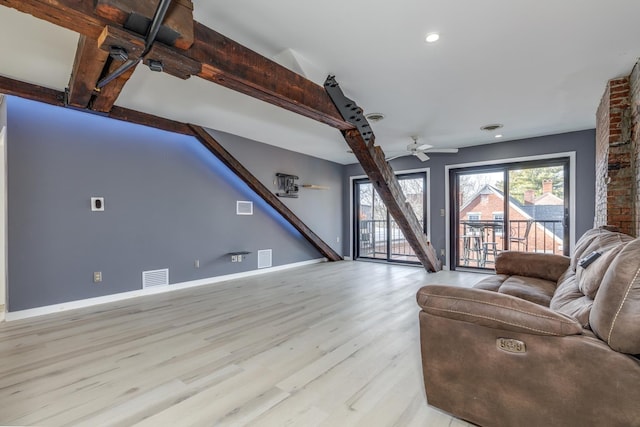 living room featuring light wood-type flooring and ceiling fan