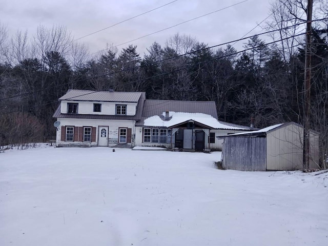 view of front of property featuring a storage unit