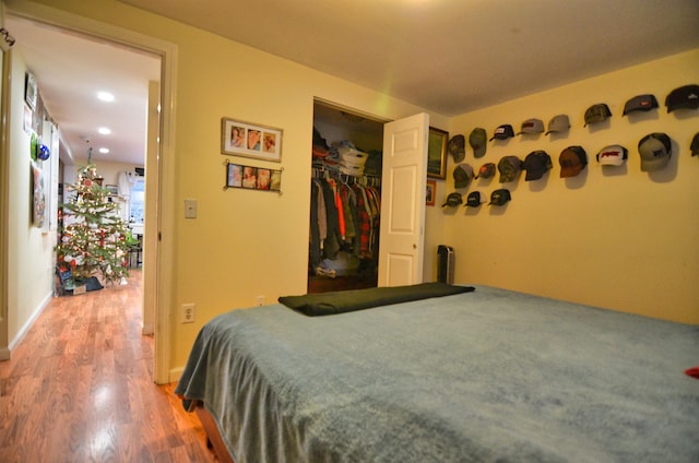 bedroom featuring a closet and hardwood / wood-style flooring