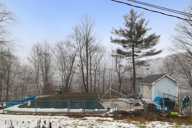 view of snow covered pool