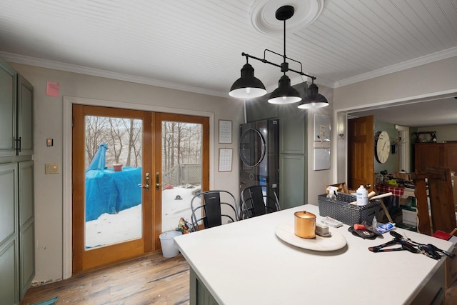 dining room featuring french doors, light hardwood / wood-style flooring, and ornamental molding