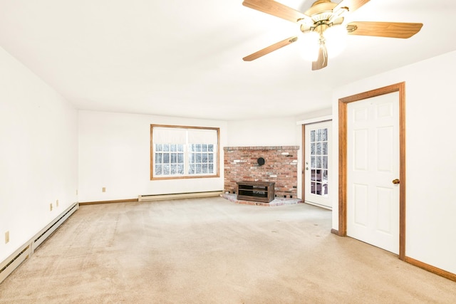 unfurnished living room featuring baseboard heating, light carpet, and ceiling fan