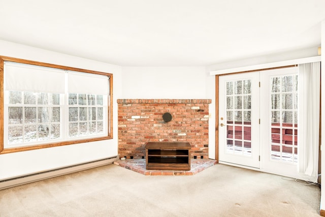 unfurnished living room with a fireplace, carpet, and a baseboard radiator