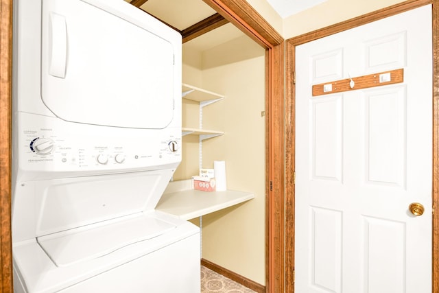 laundry room featuring stacked washer / dryer