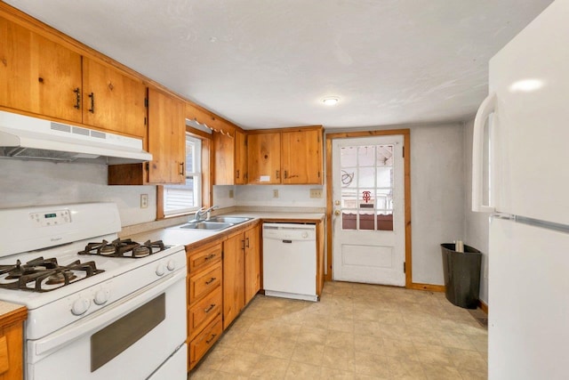 kitchen with sink and white appliances