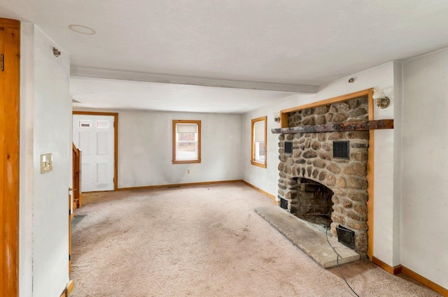 unfurnished living room featuring a fireplace and carpet flooring