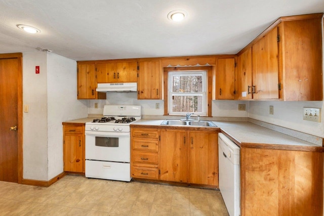 kitchen featuring sink and white appliances