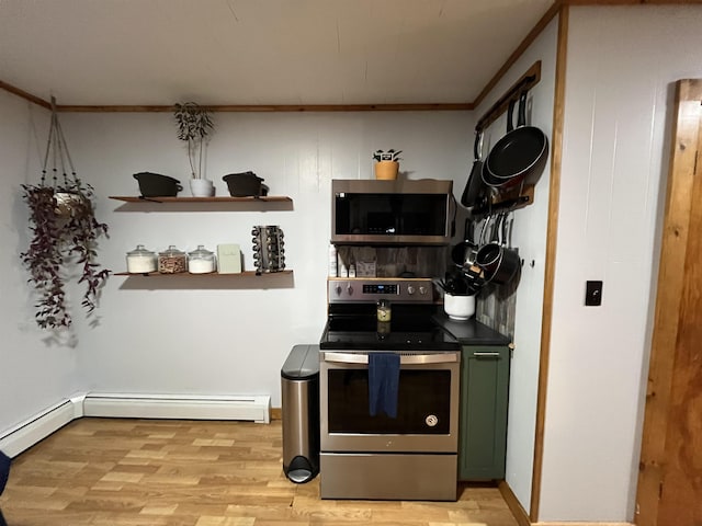 kitchen with green cabinets, a baseboard heating unit, light wood-type flooring, appliances with stainless steel finishes, and ornamental molding