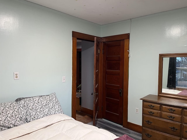 bedroom featuring dark hardwood / wood-style flooring