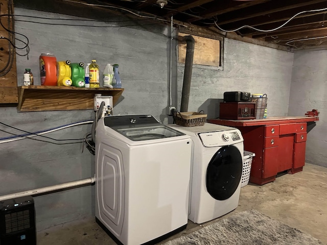 laundry room with independent washer and dryer