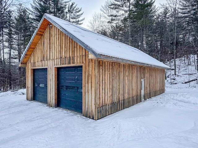 view of snow covered garage