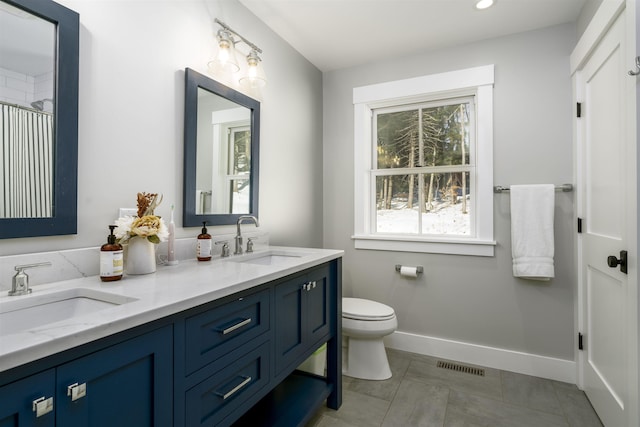 bathroom with vanity and toilet