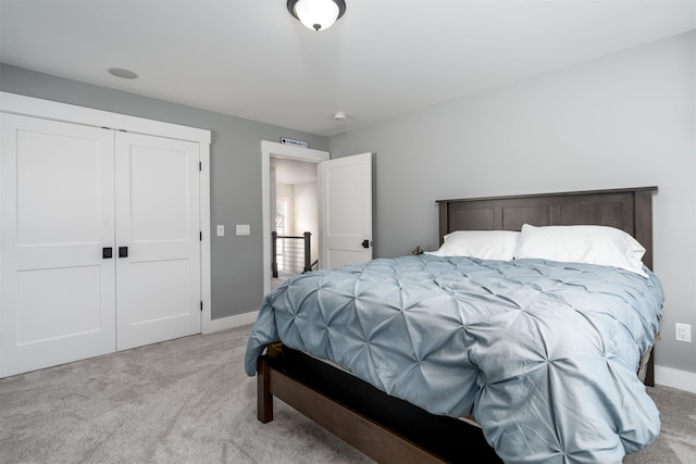 carpeted bedroom with a closet