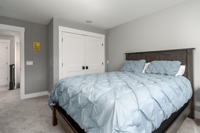 carpeted bedroom with a closet