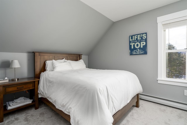 carpeted bedroom with vaulted ceiling and a baseboard heating unit