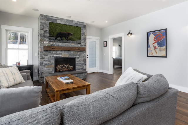 living room featuring dark hardwood / wood-style floors and a fireplace