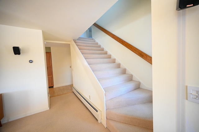 staircase with carpet and baseboard heating