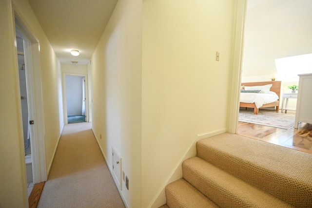 corridor with light carpet