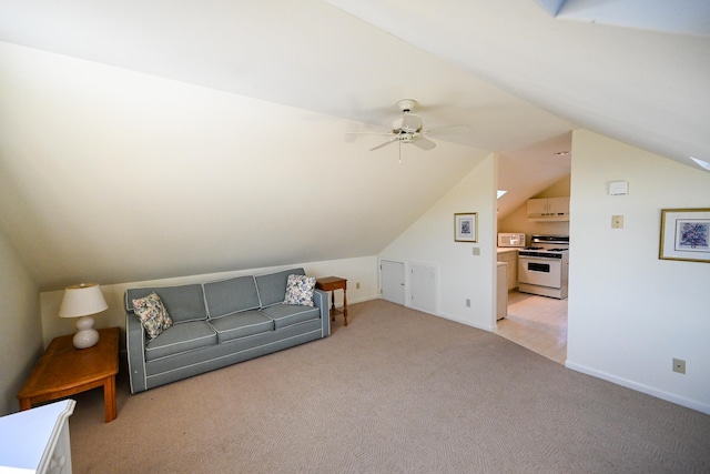 additional living space featuring light carpet, vaulted ceiling, and ceiling fan