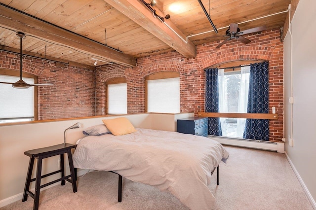 bedroom featuring beam ceiling, rail lighting, brick wall, a baseboard heating unit, and wood ceiling