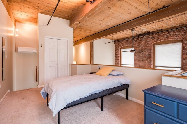 bedroom featuring beam ceiling, wooden ceiling, brick wall, a wall unit AC, and light colored carpet