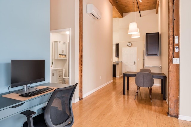 home office with light wood-type flooring, high vaulted ceiling, an AC wall unit, wooden ceiling, and beamed ceiling