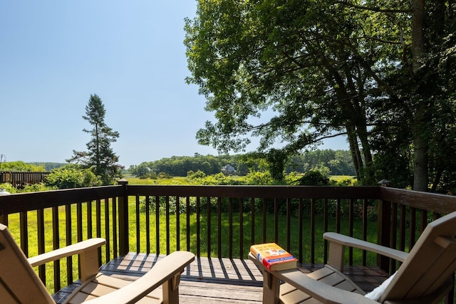 deck featuring a lawn