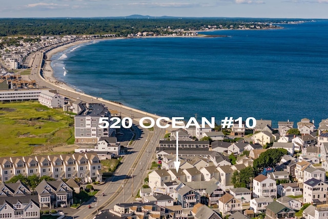 drone / aerial view with a view of the beach and a water view