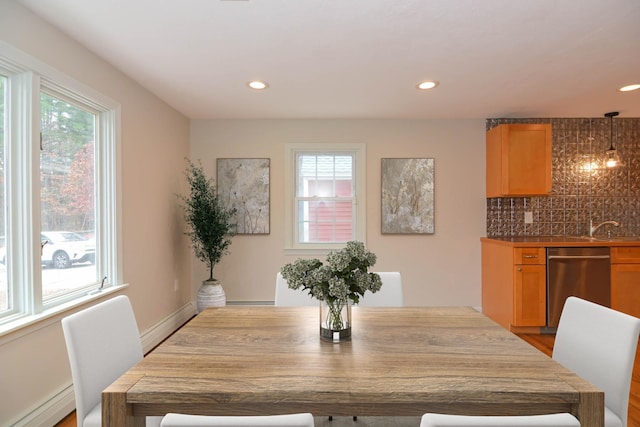 dining area featuring light hardwood / wood-style flooring and a baseboard heating unit