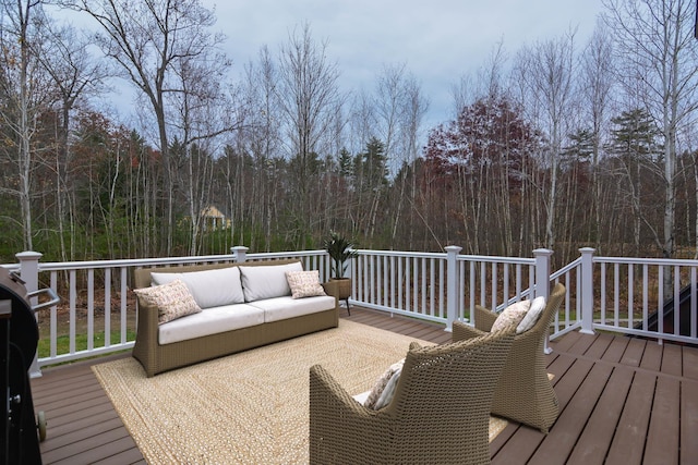 wooden terrace featuring an outdoor living space