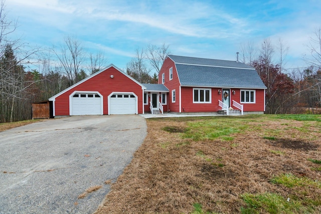 single story home featuring a front lawn and a garage