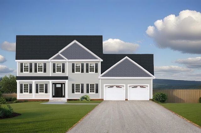 view of front of property with a garage and a front yard