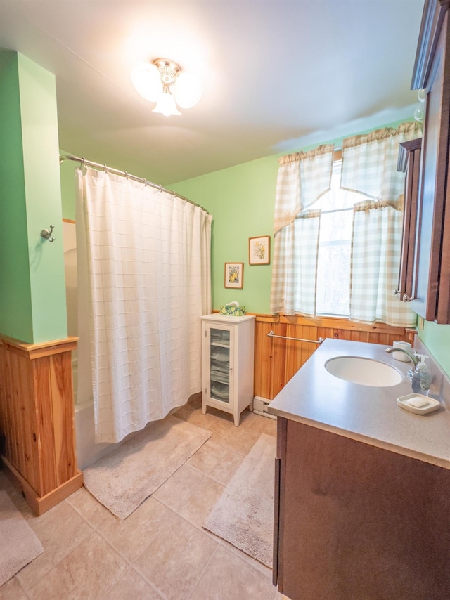 bathroom with tile patterned floors, vanity, walk in shower, and beverage cooler