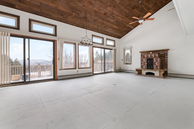 unfurnished living room with high vaulted ceiling, a baseboard heating unit, a mountain view, wood ceiling, and ceiling fan with notable chandelier