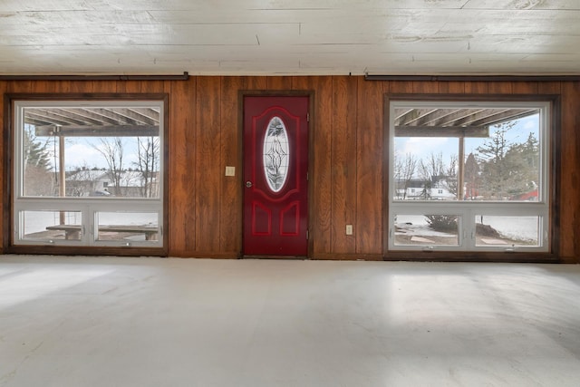 foyer entrance with wood walls