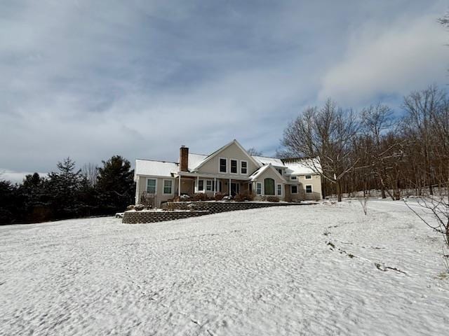 view of snow covered house