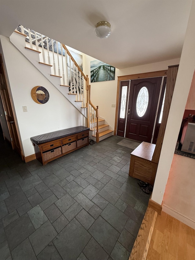 foyer entrance featuring dark hardwood / wood-style floors