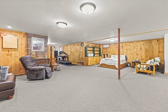 bedroom with carpet and wood walls